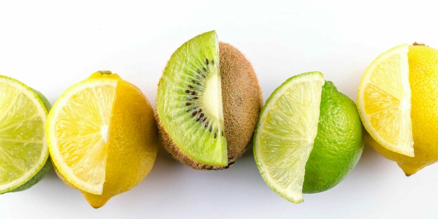variety of sliced limes, lemons, and kiwis
